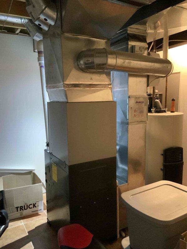 Conducted full system estimate for non-operational air conditioning unit original to 1999 construction. Inspected existing HVAC equipment in basement utility area, including furnace, ductwork distribution system, and electrical service panel connections. Documented current system configuration with exposed mechanical infrastructure, spray foam insulation installation, and existing ventilation routing. Assessed 16-year-old AC system failure and provided comprehensive replacement options for complete HVAC system upgrade to meet immediate replacement timeline within the next couple weeks.