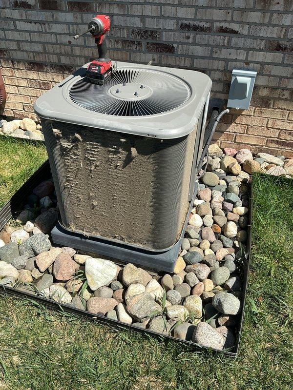 Completed annual cooling maintenance on residential air conditioning condenser unit. Performed comprehensive system inspection, cleaned condenser coils, checked refrigerant lines and insulation for proper condition, verified electrical connections at disconnect box, and tested unit operation. All components found to be functioning within normal parameters with no issues identified.