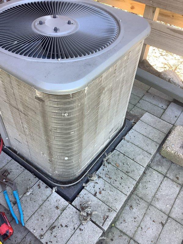Performed routine air conditioning maintenance on outdoor cylindrical condenser unit. Conducted comprehensive system inspection, checked refrigerant lines and electrical connections, cleaned fan assembly and exterior coils, and verified proper operation of all components. Unit tested successfully with all parameters within normal operating range.