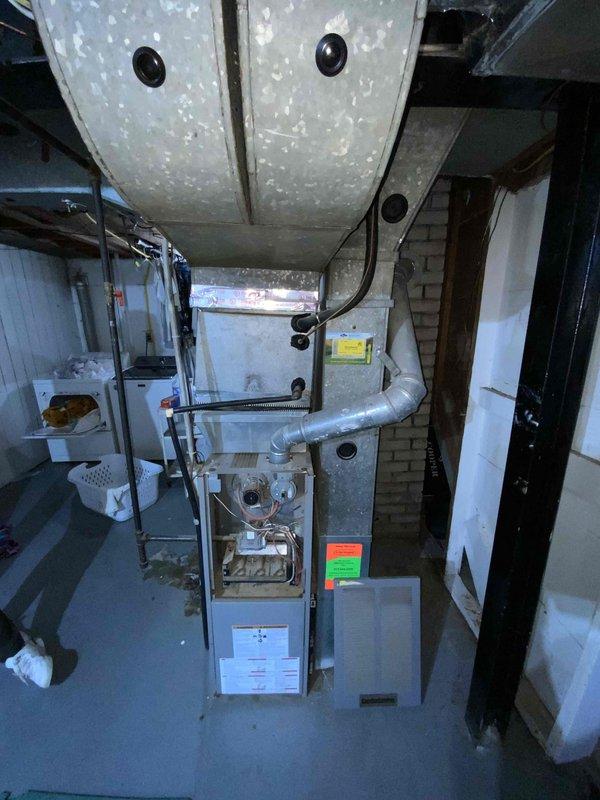 Conducted comprehensive assessment of aging HVAC system in basement installation, evaluating 20-year-old natural gas furnace and 18-year-old air conditioning unit for complete replacement. Both heating and cooling systems have exceeded their expected service life and require full replacement to ensure reliable climate control for the small to mid-sized residential space. Documented existing equipment configuration, ductwork connections, and utility room layout to provide accurate replacement estimate for combined furnace and AC system upgrade scheduled within the next two months.