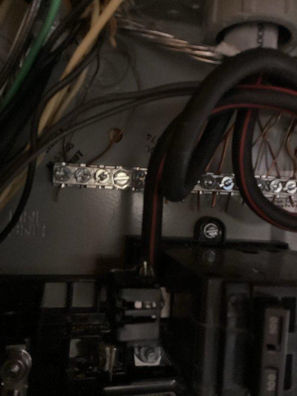 Completed electrical panel violation repairs per recall notice. Addressed code compliance issues by properly securing and organizing multiple circuit conductors, ensuring all wire terminations at breaker box and terminal blocks met current NEC standards. Reorganized bundled wiring, verified proper grounding connections, and confirmed all circuit breakers were correctly installed and operational within the main distribution panel.