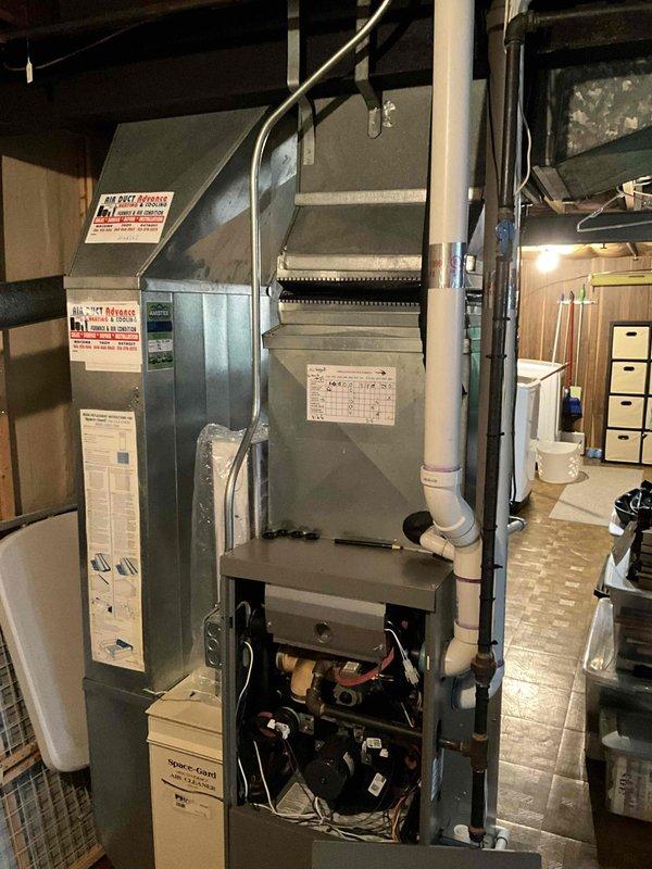 Conducted comprehensive assessment of existing 15-18 year old Lennox natural gas furnace and air conditioning system located in basement utility area. Evaluated current operational status of functioning equipment, documented existing installation configuration including ductwork connections, PVC venting, condensate drainage system, and electrical connections. Provided detailed replacement estimate options for complete HVAC system upgrade to address aging equipment concerns and improve energy efficiency.