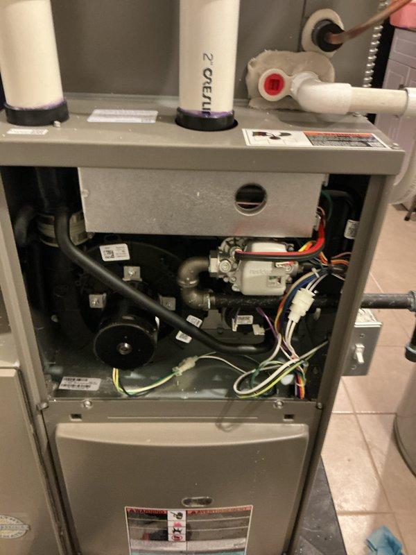 Completed annual furnace maintenance tune-up on Lennox gas furnace unit as part of Air Care Membership program. Performed comprehensive inspection of all internal components including blower motor assembly, heat exchanger, burner operation, gas connections, electrical systems, and condensate drain assembly with trap. Verified proper operation of all safety controls, checked and adjusted airflow, inspected venting system including PVC intake and exhaust pipes, and confirmed all manufacturer specifications are being met. Unit operating efficiently with no issues found.
