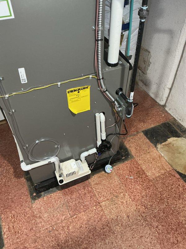 Completed full HVAC system installation including 90,000 BTU furnace and 3-ton air conditioning unit with left-side configuration. Installed humidifier, established all necessary PVC condensate drainage lines, reconnected gas supply lines, and routed metallic ductwork and electrical connections. Obtained mechanical and electrical permits prior to installation, with all work performed to code in basement utility area.