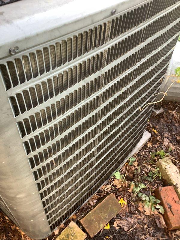 Completed routine ACM maintenance on outdoor condenser unit. Unit was inspected and found operational with significant debris accumulation around base and dirty condenser coils requiring attention. Cleared leaves, mulch, and landscaping debris from around equipment base and removed obstructions to ensure proper airflow and prevent future operational issues.