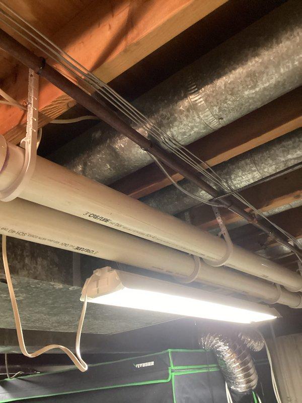 Completed full HVAC system installation including a 110,000 BTU furnace and 4-ton air conditioning unit with right-side configuration. Installed new PVC condensate drainage system with proper pitch and routing through basement ceiling joists, connected to existing drain lines. Ran new supply and return ductwork utilizing galvanized metal trunk lines and flexible duct branches, securing all connections to floor joists. Established proper refrigerant line set routing with copper piping, installed electrical disconnects and wiring for both units, and reconnected all system components to existing infrastructure. All mechanical permits were obtained prior to installation, and system was tested for proper operation upon completion.
