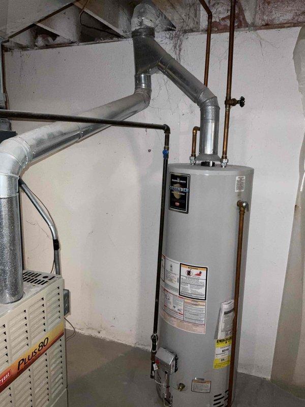 Conducted comprehensive on-site evaluation of existing 15-year-old residential HVAC system including air conditioning unit and furnace to provide full system replacement estimate. Assessed current equipment condition, documented existing installation configuration including ductwork and ventilation infrastructure, and photographed mechanical room setup with furnace and associated water heater for reference. Customer requesting replacement within next couple weeks due to age of equipment.
