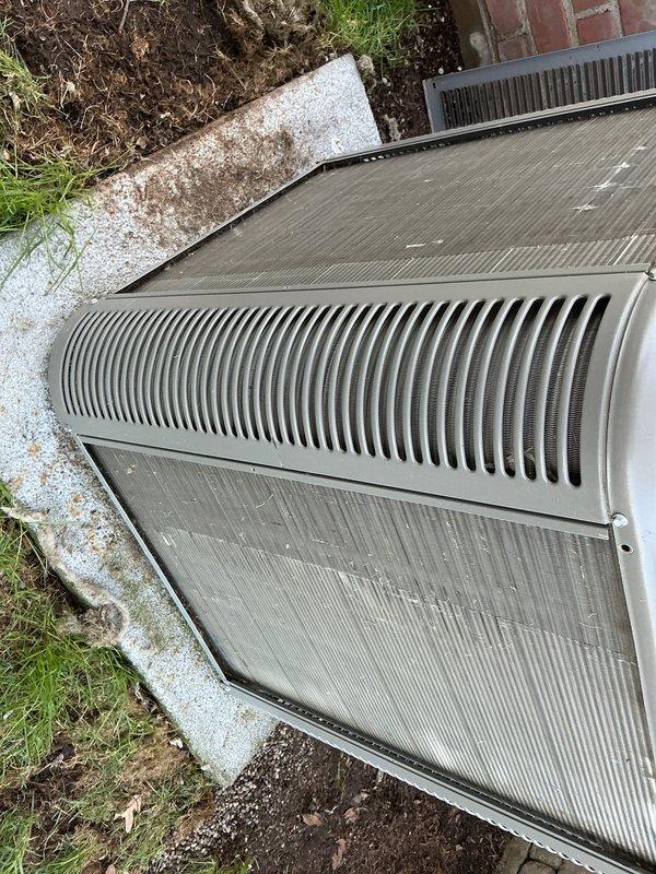 Completed annual condenser maintenance on outdoor HVAC unit. Performed dry brush cleaning of condenser coils and fins to remove accumulated dirt, debris, and organic matter due to water source being unavailable at time of service. Unit inspected and found in operational condition with all protective panels and grilles intact.