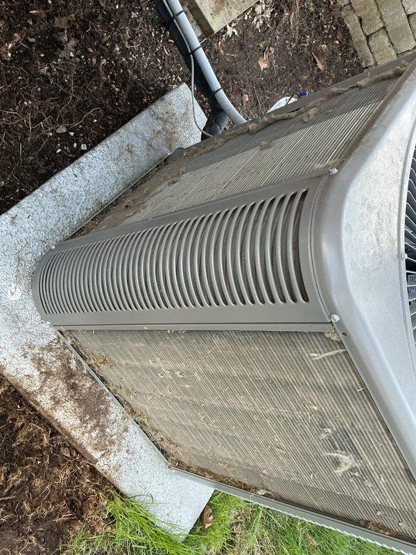 Completed annual condenser maintenance on outdoor HVAC unit. Performed dry brush cleaning of condenser coils and fins to remove accumulated dirt, debris, and organic matter due to water source being unavailable at time of service. Unit inspected and found in operational condition with all protective panels and grilles intact.