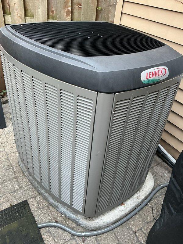 Completed annual cooling maintenance on Lennox residential air conditioning system. Performed comprehensive inspection of outdoor condensing unit, verified proper operation of all components, and documented equipment condition with photographs. Unit found in good working order with normal outdoor weathering present on cabinet and mesh panels.