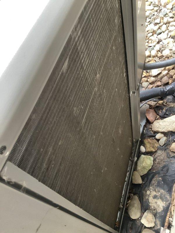 Completed routine Air Care Maintenance on residential air conditioning system. Performed standard ACM procedures including inspection of outdoor condenser unit, replaced air filters as requested, and conducted operational testing with diagnostic equipment. Condenser coils showed moderate dirt and debris accumulation with visible dust buildup between fins; cleaned coil surfaces to restore proper airflow and heat transfer efficiency. Unit operational and running within normal parameters upon completion.
