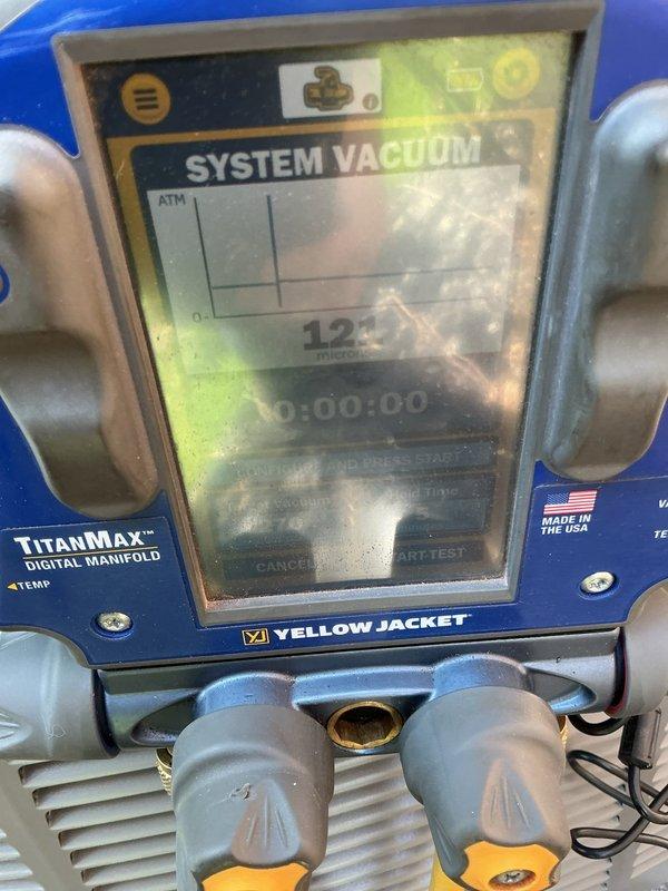 Completed callback service to address condenser positioning concerns following initial installation of 110,000 BTU furnace and 4-ton air conditioning system. Rotated outdoor condenser unit 180 degrees to improve aesthetics and functionality, properly secured and insulated vent piping, and trimmed PVC discharge lines as needed. Performed system vacuum test using digital manifold gauges to verify refrigerant system integrity after repositioning equipment.