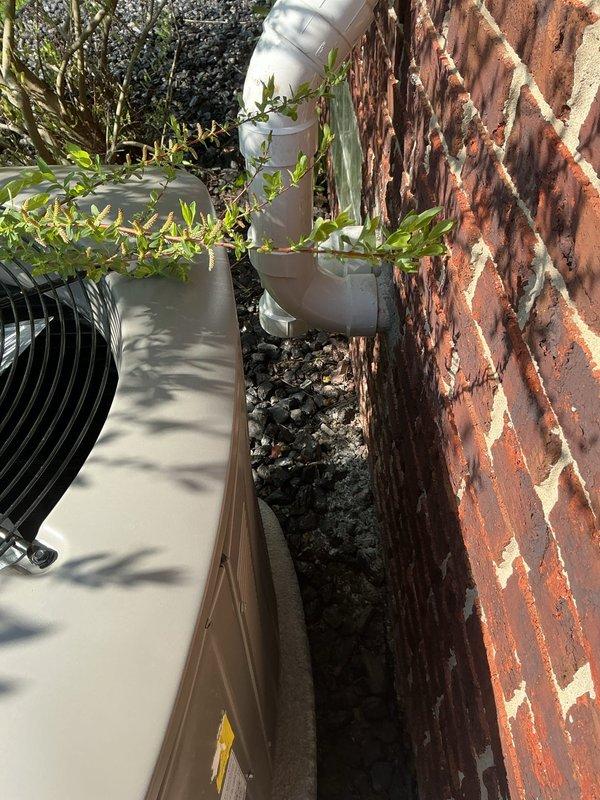 Completed callback service to address condenser positioning concerns following initial installation of 110,000 BTU furnace and 4-ton air conditioning system. Rotated outdoor condenser unit 180 degrees to improve aesthetics and functionality, properly secured and insulated vent piping, and trimmed PVC discharge lines as needed. Performed system vacuum test using digital manifold gauges to verify refrigerant system integrity after repositioning equipment.