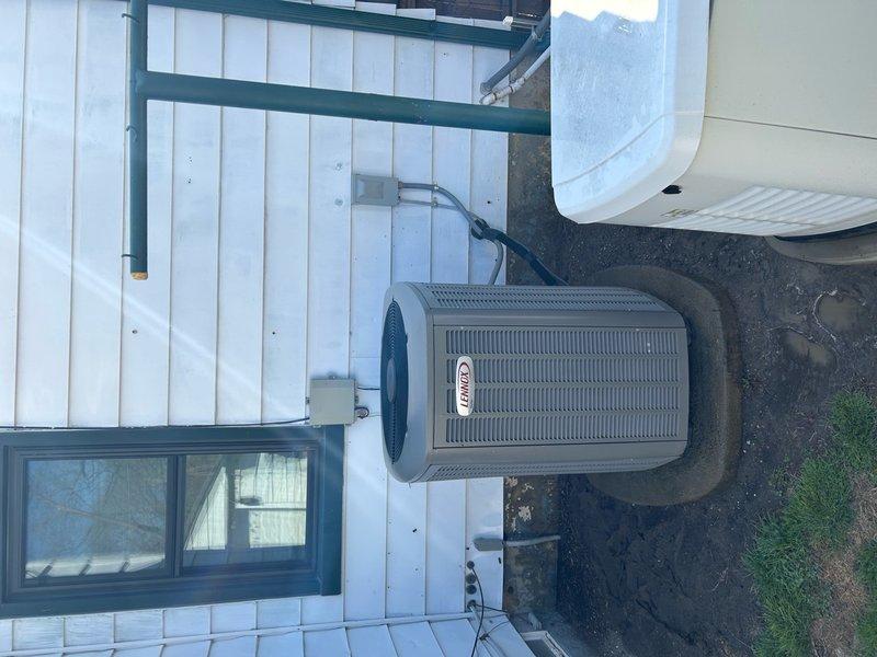 Performed scheduled maintenance on Lennox air conditioning system. Replaced air scrubber UV bulb as specified. Inspected outdoor condensing unit, noting significant debris accumulation on condenser coils requiring attention for optimal system performance.