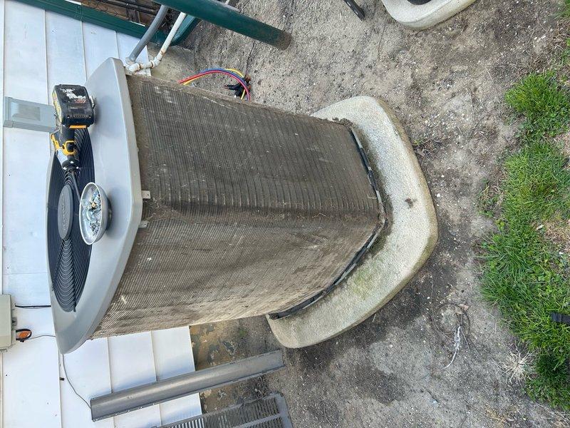 Performed scheduled maintenance on Lennox air conditioning system. Replaced air scrubber UV bulb as specified. Inspected outdoor condensing unit, noting significant debris accumulation on condenser coils requiring attention for optimal system performance.