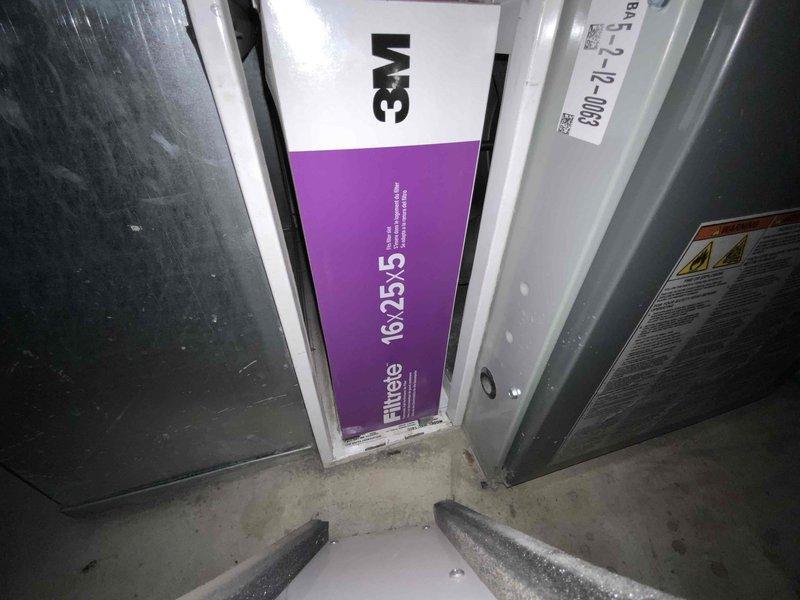 Conducted comprehensive estimate for complete air conditioning system replacement. Existing AC unit exhibiting refrigerant line freezing and inadequate cooling capacity, unable to maintain temperature below 74°F. System age unknown but confirmed to be significantly aged beyond serviceable lifespan. Inspected current installation including air handler with 3M Filtrete 16x25x5 filter assembly, ductwork connections, and electrical service panel configuration in basement utility area. Documented existing equipment conditions and infrastructure to provide accurate replacement specifications and installation requirements for new high-efficiency cooling system.