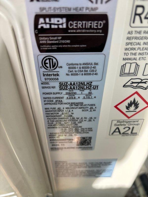 Successfully completed installation of Mitsubishi ductless mini-split heat pump system. Installed Mitsubishi SUZ-AA12NLHZ outdoor condenser unit on composite pad as requested by customer and floor-mounted indoor air handler unit in interior room with beige tile flooring. Ran refrigerant lines and established connections between indoor and outdoor components. Installed new dedicated electrical circuit to power the system, meeting all electrical code requirements. Secured all necessary permits including mechanical, electrical, and mini-split specific permits prior to installation. System is factory-charged with A2L refrigerant and rated for 208/230V, single-phase, 60Hz operation with IPX4 protection rating. Verified all AHRI certifications and ETL Intertek compliance markings. Tested system operation to ensure proper heating and cooling functionality. All components installed per manufacturer specifications and local building codes.