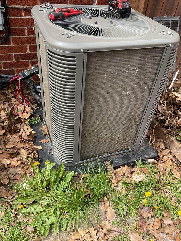 Completed annual cooling maintenance on residential outdoor condenser unit. Performed comprehensive system inspection, tested electrical components with multimeter, verified proper amperage draws, and checked refrigerant pressures. Cleaned condenser coils, secured access panels with power tools, and confirmed fan motor operation and airflow through louvers.