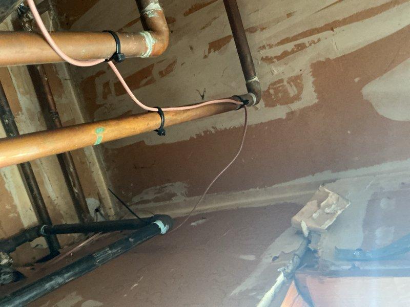 Responded to warranty call for low voltage issue affecting thermostat and air conditioning system that had been occurring for three days. Diagnosed failed transformer and damaged thermostat wire as root cause of malfunction. Ran new 5-wire thermostat cable from air handler to thermostat location, replaced defective transformer, and restored proper 24VAC control voltage to system. Verified thermostat communication and tested air conditioning operation to confirm proper system functionality upon completion.