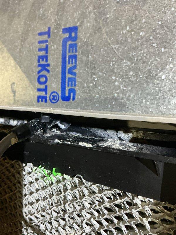 Completed annual cooling maintenance on residential air conditioning system. Inspected outdoor condenser unit, which showed significant debris accumulation in fins and coils from surrounding vegetation. Cleaned condenser coils and exterior surfaces, removed leaves, twigs, and organic matter from fin assembly to restore proper airflow and heat transfer efficiency. Verified unit operation and documented equipment condition with photos for customer records.
