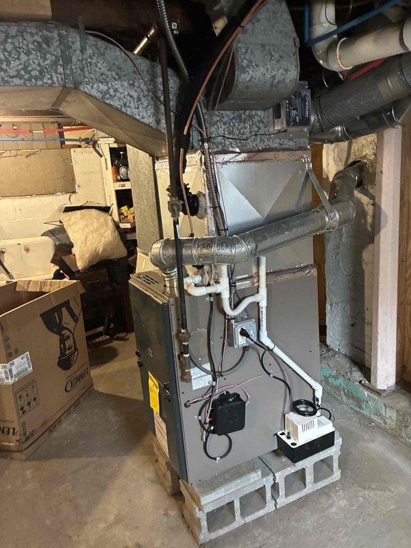 Successfully installed a 2-ton air conditioning system with matching evaporator coil in basement utility area. Established new dedicated electrical circuit to code specifications and completed all mechanical and electrical connections to existing furnace system. All permits obtained and installation completed per manufacturer specifications with system tested and operational.