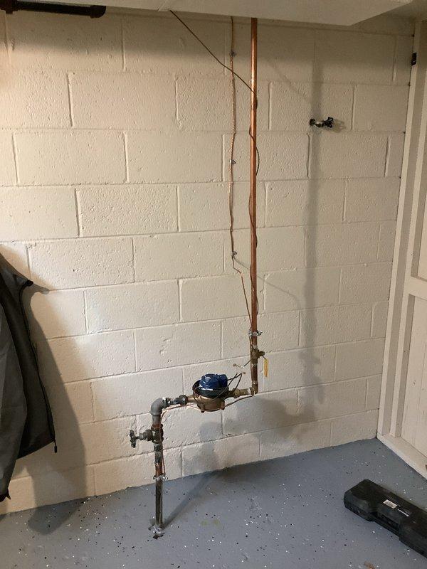 Completed electrical recall work for HVAC installation to bring system into code compliance. Installed equipment grounding conductor (EGC) and ground rod for sub panel, disconnecting improper grounding from water pipe. Installed underground feeder conductors to sub panel and AC feed to proper burial depth in excavated trench alongside building foundation. Removed obsolete electrical wiring from garage. Upgraded garage electrical outlets to GFCI protection and installed one additional general-purpose GFCI-protected outlet in garage per code requirements.