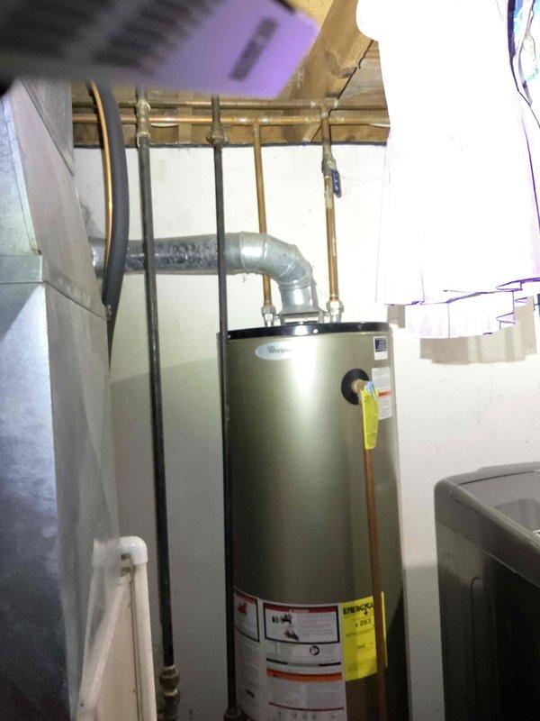 Conducted comprehensive full system estimate for HVAC replacement at residential property with 16-year-old furnace and air conditioning equipment. Evaluated existing outdoor AC unit with cylindrical configuration and assessed basement mechanical room housing current water heater and HVAC infrastructure, noting exposed ductwork, copper plumbing lines, and available space for high-efficiency equipment installation. Provided recommendations for complete system upgrade to meet customer's energy efficiency goals in coordination with planned roof and window replacement project.
