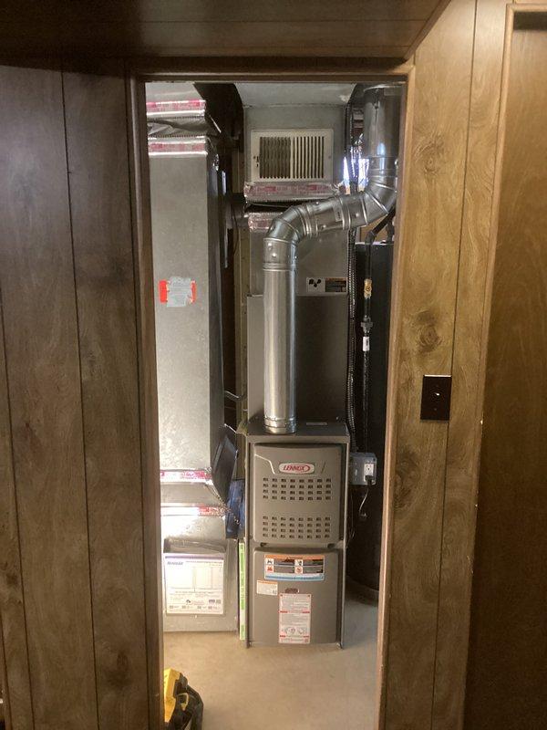 Completed full HVAC system installation including a Lennox 70,000 BTU furnace and 2-ton air conditioning unit with left-side configuration. Installed all required ductwork, electrical connections, and refrigerant lines, performed vacuum test achieving proper micron levels (432 microns recorded), and reconnected system components. Obtained mechanical and electrical permits prior to installation, and all work was completed per manufacturer specifications and local code requirements.