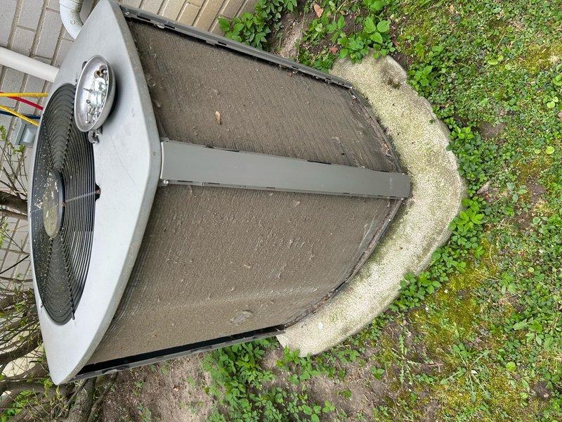 Completed routine air conditioning maintenance on residential condensing unit. Inspected outdoor unit positioned on concrete pad, verified proper operation of condenser fan and motor, checked refrigerant lines and electrical connections, and documented equipment condition through photographic records. Unit operational and ready for cooling season.