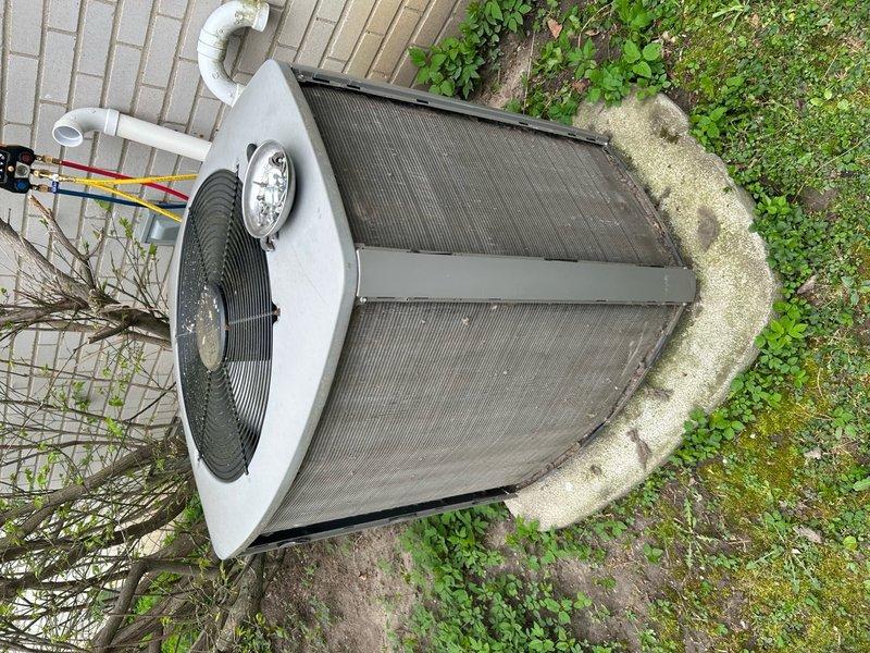 Completed routine air conditioning maintenance on residential condensing unit. Inspected outdoor unit positioned on concrete pad, verified proper operation of condenser fan and motor, checked refrigerant lines and electrical connections, and documented equipment condition through photographic records. Unit operational and ready for cooling season.