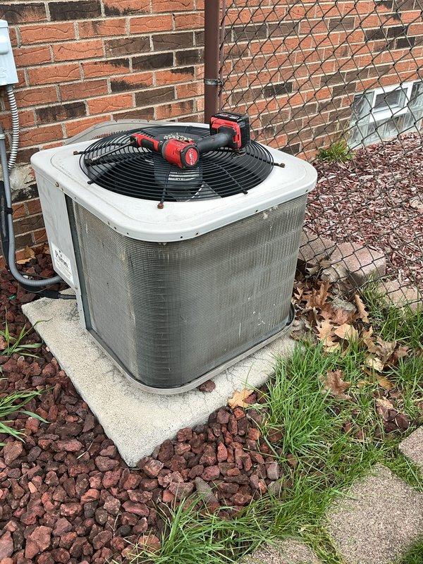 Completed annual cooling maintenance on residential split system. Connected manifold gauges to measure refrigerant pressures and temperatures, verified system operating temperatures of 120.0°F and 26.33°F, inspected outdoor condensing unit condition, and replaced air filter per maintenance protocol.