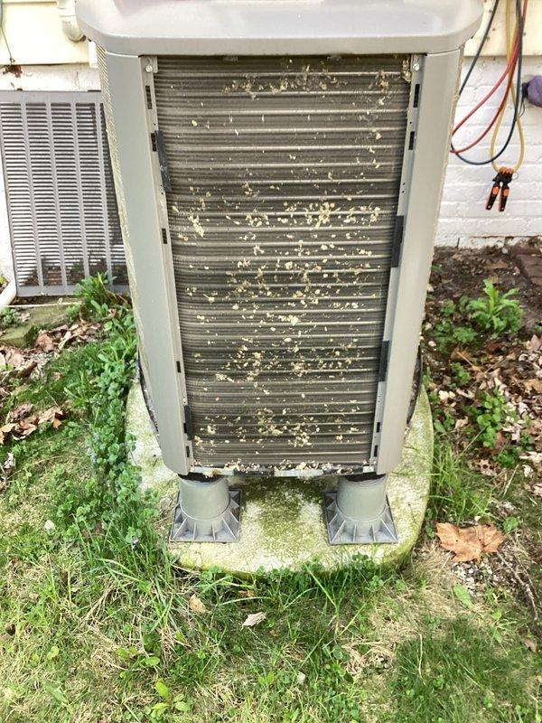 # HVAC Maintenance - Air Handler

Completed comprehensive AC tune-up and preventative maintenance on a 4-year-old residential air conditioning system. The outdoor condenser unit exhibited heavy accumulation of pollen, dust, seeds, and organic debris throughout the heat exchanger coil fins, which was thoroughly cleaned to restore optimal airflow and heat transfer efficiency. All system components were inspected, tested, and confirmed to be operating properly with no deficiencies noted.