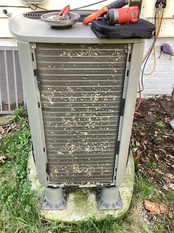 # HVAC Maintenance - Air Handler

Completed comprehensive AC tune-up and preventative maintenance on a 4-year-old residential air conditioning system. The outdoor condenser unit exhibited heavy accumulation of pollen, dust, seeds, and organic debris throughout the heat exchanger coil fins, which was thoroughly cleaned to restore optimal airflow and heat transfer efficiency. All system components were inspected, tested, and confirmed to be operating properly with no deficiencies noted.