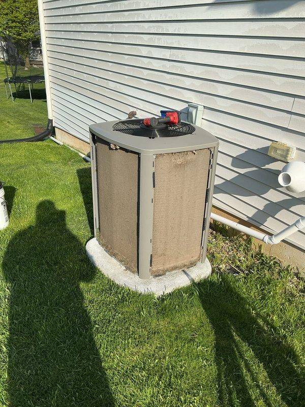 Completed comprehensive AC tune-up on 2-year-old Lennox condenser unit. Performed standard maintenance protocol including refrigerant pressure checks using manifold gauges, inspected electrical connections, verified proper operation of compressor and condenser fan motor, cleaned condenser coils, and confirmed adequate airflow through unit. System operating within normal parameters with no deficiencies noted; condensate drain line clear and functioning properly.