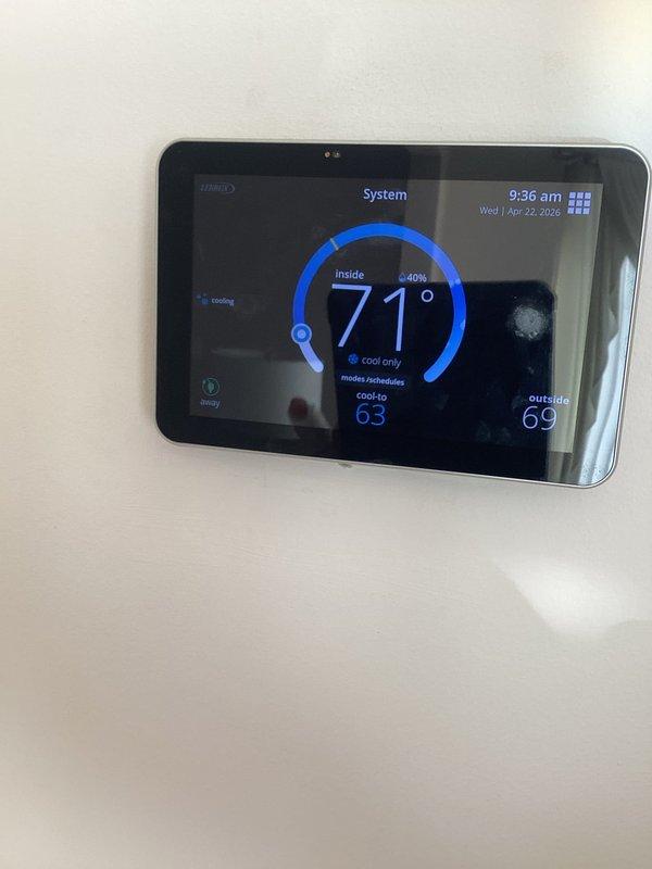 Completed annual cooling maintenance on residential HVAC system. Performed system diagnostics using manifold gauges, recording operating pressures of 10.6 psig low side and 326.5 psig high side with superheat at 22.7°F and subcooling at 21.7°F. Verified thermostat operation and programming, confirming proper communication between control and equipment. System operating within normal parameters; noted filter and evaporative cooler pads require replacement at customer's earliest convenience.