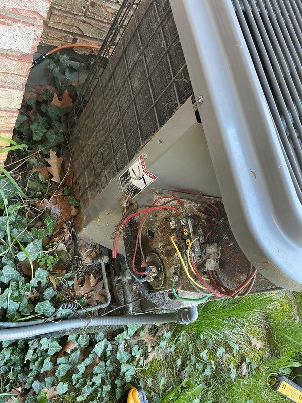 # HVAC Maintenance - Air Conditioning Unit

Performed scheduled preventive maintenance on residential outdoor air conditioning condensing unit. Conducted comprehensive inspection of electrical components including contactor, wiring connections, and control circuits. All electrical connections were found secure with proper voltage readings. Cleaned accumulated dirt and debris from internal electrical compartment to prevent potential component failure and ensure optimal operation.

Inspected condenser coil fins and top discharge grille for proper airflow. Verified unit is sitting level on concrete pad with adequate clearance from surrounding vegetation. Noted minor accumulation of leaves and organic debris around base of unit, which is typical for outdoor installations with nearby landscaping. Checked refrigerant lines and electrical conduit for proper support and protection.

Unit operational status confirmed with all safety controls functioning as designed. System operating within norm