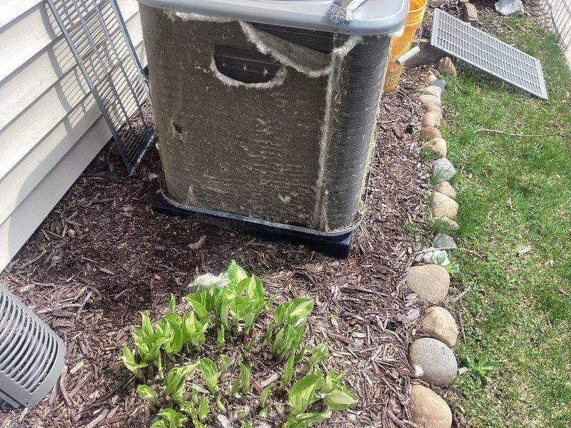 Completed comprehensive 5-year recurring ComfortGuard maintenance visit on residential outdoor HVAC system. Performed thorough inspection and cleaning of air conditioning condenser unit, which exhibited significant accumulation of dirt, grime, and debris on exterior surfaces. Cleaned condenser coils, removed cobwebs and environmental buildup from unit housing and components. Verified proper operation of condenser fan and assessed overall system condition. Inspected installation site including base pad stability, clearances, and surrounding drainage components. Unit returned to optimal operating condition following maintenance protocol.