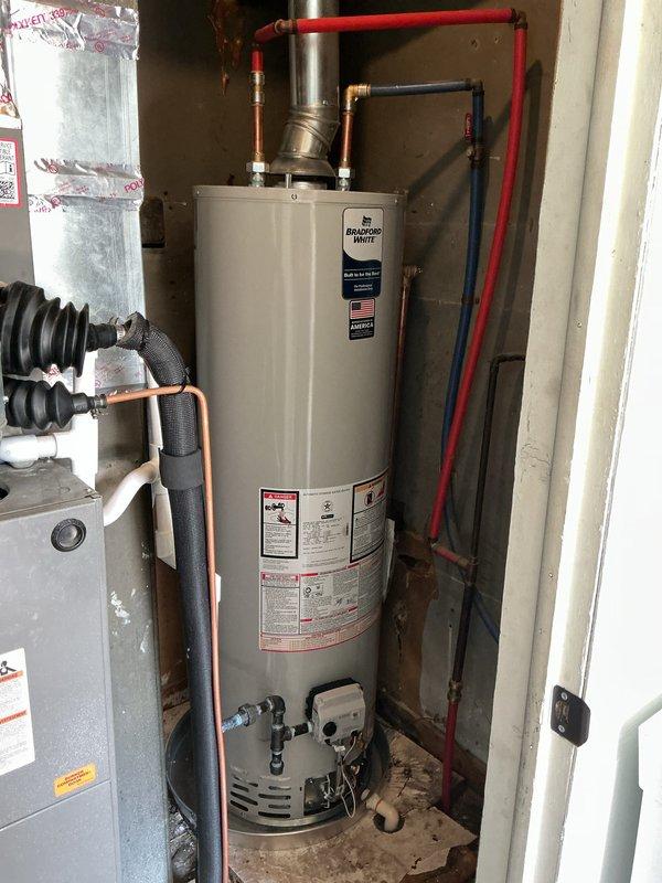 Successfully installed a 40-gallon Bradford White residential water heater in utility closet. Connected hot and cold water supply lines using PEX and copper piping, installed gas control valve and flue exhaust ventilation system, and completed all electrical and mechanical connections per manufacturer specifications and local code requirements.