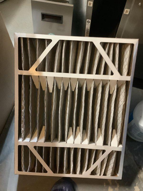 Completed comprehensive ComfortGuard maintenance package on residential HVAC system. Inspected and documented air filter condition showing clean pleated media with proper airflow capacity, examined gas furnace burner assembly confirming proper ignition ports and flame distribution, and verified gas valve operation and control components functioning within manufacturer specifications.