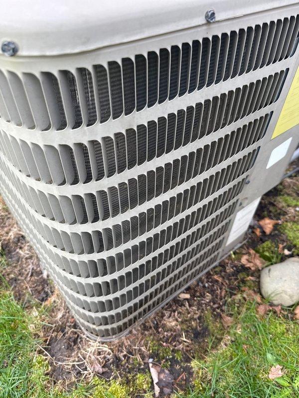 Completed annual HVAC maintenance on outdoor condenser unit, performing diagnostic testing with digital meter and checking electrical connections. Unit showed normal operating condition with no visible damage or unusual wear, and all systems tested within acceptable parameters.