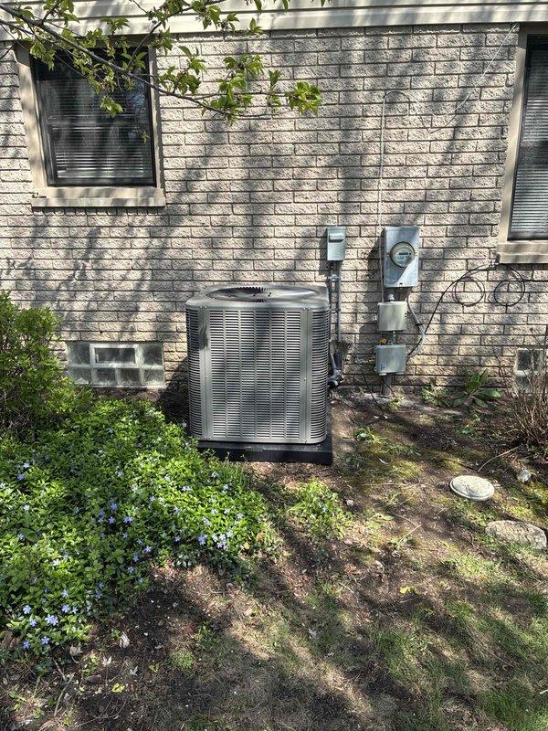 Completed full HVAC system installation including a 90,000 BTU gas furnace and 3.5 ton air conditioning unit with rear discharge configuration. Installed new furnace in basement on equipment platform with proper venting via PVC piping and connected supply and return ductwork. Mounted outdoor condensing unit on concrete pad with electrical disconnect and proper refrigerant line connections. Added whole-home humidifier to system and reconnected all existing ductwork to new equipment. All mechanical, refrigeration, and electrical connections completed per manufacturer specifications and local code requirements. System tested and verified operational.