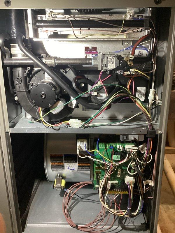 Completed comprehensive 5-year ComfortGuard maintenance visit on residential forced-air heating and cooling system. Performed thorough internal inspection of furnace unit, accessing blower assembly and burner compartments to verify proper operation of all mechanical and electrical components including blower motor, gas valve assembly, ignition system, and control boards. Conducted refrigerant system diagnostics on outdoor condensing unit using calibrated manifold gauges, measuring system pressures and confirming R-410A charge levels within manufacturer specifications at 1039 PSI low side and appropriate superheat/subcooling readings. Inspected all electrical connections, wiring harnesses, and safety controls throughout both indoor and outdoor units. Verified proper airflow through heat exchanger and evaporator coil. All system components found operating within normal parameters with no deficiencies noted requiring immediate attention.