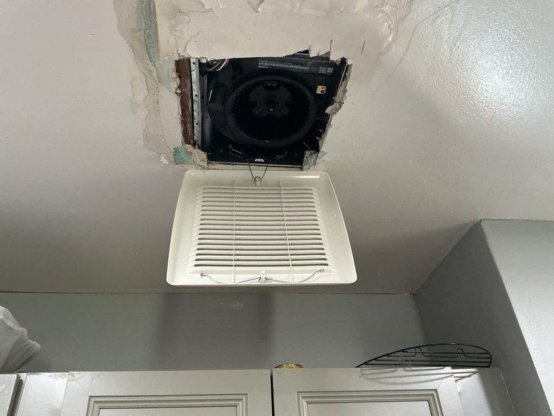 Manager conducted site visit to assess ceiling damage and non-functional exhaust fan following recent furnace and air conditioning installation. Upon inspection, determined exhaust fan required removal and return to shop for evaluation, with visible ceiling deterioration observed around ventilation grille and exposed ductwork connection. Documented damage with photos showing displaced vent cover and compromised ceiling material for warranty claim processing.