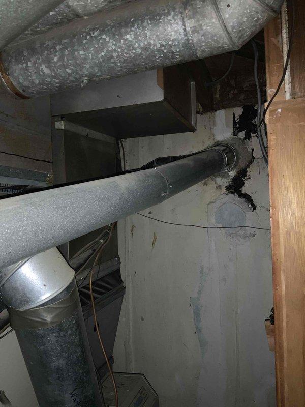 Responded to service call for non-functional air conditioning system requiring replacement estimate. Conducted on-site assessment of existing Goodman HVAC installation located in interior utility closet, documenting equipment configuration including furnace, air handler/evaporator coil, and associated ductwork. Performed dimensional measurements of mechanical room space and existing equipment to determine replacement system specifications and installation requirements. Photographed current system layout, ductwork routing, clearances, and mechanical room conditions to facilitate accurate equipment sizing and proposal preparation for expedited replacement installation.