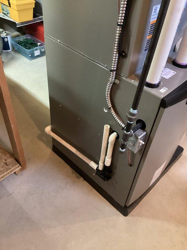 Completed full HVAC system installation including a 90,000 BTU gas furnace with humidifier and 3-ton air conditioning unit in left-side configuration. Successfully obtained mechanical and electrical permits prior to installation. Reconnected all necessary utilities including gas, electrical, and condensate drainage systems. All equipment properly installed on platform base with copper refrigerant lines insulated, flexible gas connector attached, and electrical conduit routed per code requirements. System tested and operational upon completion with all manufacturer labels and documentation affixed to equipment.