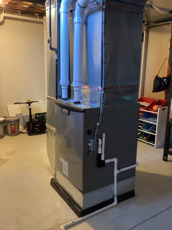 Completed furnace-only installation of a 135,000 BTU high-efficiency unit in basement mechanical room. Installation included proper venting with PVC intake and exhaust piping, electrical and gas reconnection, and humidifier integration with existing ductwork. All mechanical and electrical permits obtained, system tested and operational upon completion.