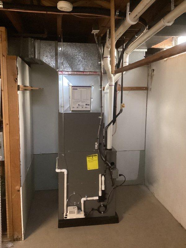 Completed full HVAC system installation including a 70,000 BTU gas furnace (model ML196UH070XE36BK-01) and 2-ton air conditioning unit with rear discharge configuration. Installation included ductwork with galvanized metal transitions, furnace liner, PVC condensate drainage system, and complete electrical reconnection. All required mechanical and electrical permits were obtained prior to installation, and system was fully commissioned and operational upon completion.