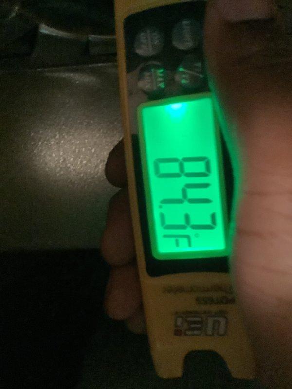 Completed scheduled preventive maintenance on residential air conditioning system. Performed temperature diagnostics using infrared thermometer, recording supply air temperature of 62.6°F to verify proper cooling performance. Inspected outdoor condensing unit, noting normal operational condition of condenser coil and heat exchanger with typical seasonal debris accumulation around base. All components functioning within manufacturer specifications at time of inspection.