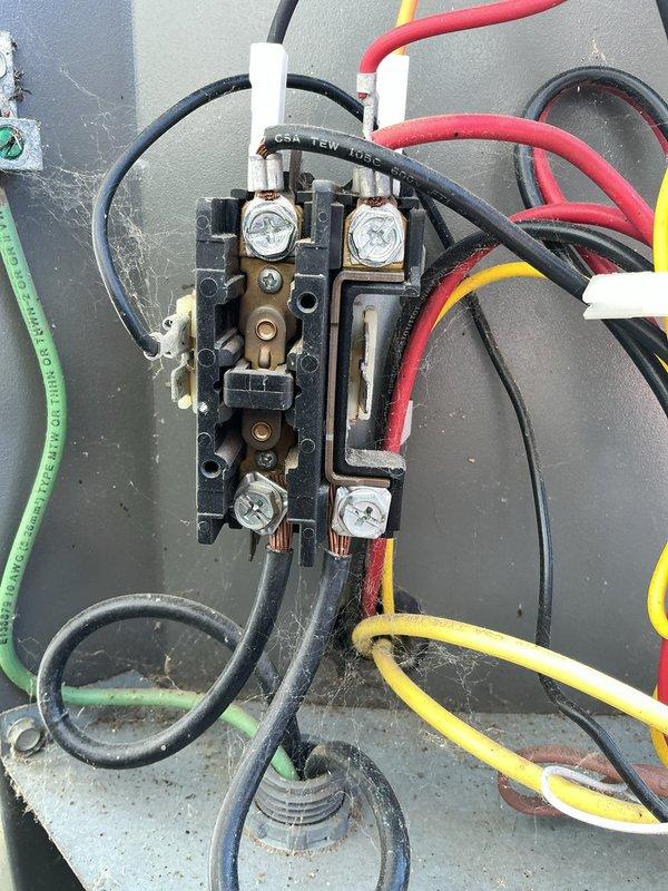 Completed annual cooling maintenance inspection on HVAC system. Performed comprehensive electrical connection inspection, documenting terminal block and contactor assembly condition. Noted multiple wire connections including power supply lines and control wiring with appropriate color coding present. Observed normal wear and minor surface oxidation on terminal points consistent with equipment age. All electrical connections verified secure with proper torque on terminal screws. System operational at time of departure.