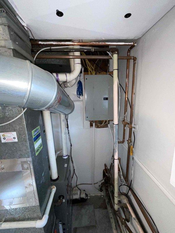 Conducted on-site evaluation for installation of new central air conditioning system in a small to mid-sized residence with no existing AC infrastructure. Assessed utility closet and mechanical space to determine optimal placement for packaged cooling unit, reviewed existing ductwork, copper plumbing lines, electrical panel capacity, and available mounting locations. Provided comprehensive estimate for complete AC system installation including equipment, refrigerant lines, condensate drainage, electrical connections, and integration with existing building systems.